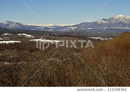 Distant view of Mt. Shia and the Tateyama mountain range of the Northern Alps from Kita Karuizawa Futikami Pass observation platform 113206362