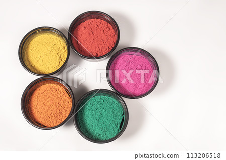 Top view of colorful traditional holi powder in bowl isolated on white background. 113206518