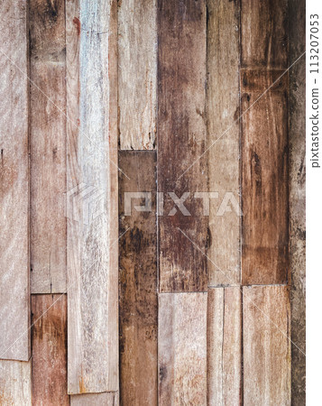 Detail of a brown wooden wall texture and background with copy space Detail of a brown wooden wall texture and background with copy space 113207053