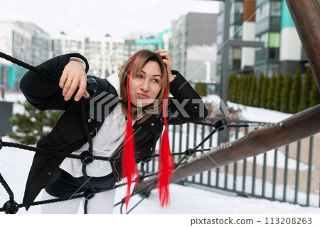 Lifestyle concept, Caucasian woman walking in the cold in the city Lifestyle concept, Caucasian woman walking in the cold in the city 113208263