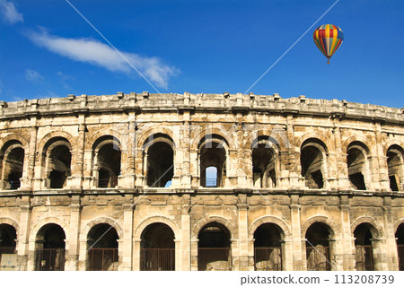Balloon composite floating over the ancient Roman amphitheatre 113208739