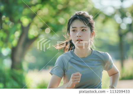 Woman jogging in the park 113209433