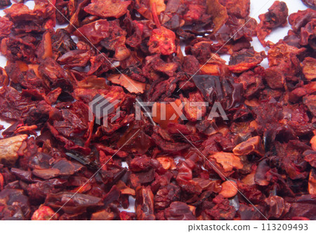 Dried bell pepper or paprica red spice in spoon isolated on the white 113209493