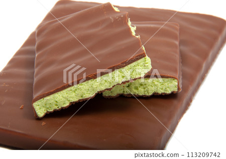 Milk chocolate with mint filling isolated on the white 113209742
