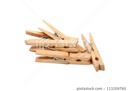 wooden clothes pegs isolated on the white 113209760