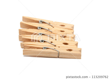 wooden clothes pegs isolated on the white 113209762