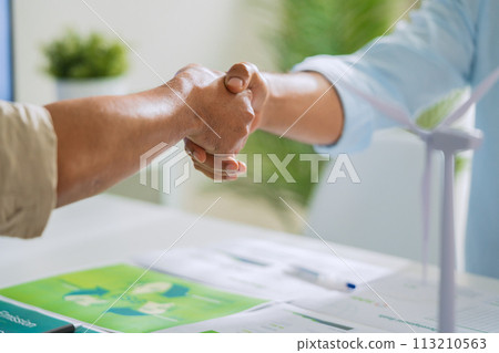 close up handshake esg environment agreeement,cooperate partnership at green office 113210563