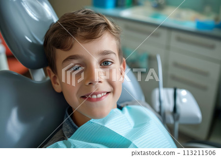 Photo of smiling boy in dental chair, visit to the dentist Photo of smiling boy in dental chair, visit to the dentist 113211506
