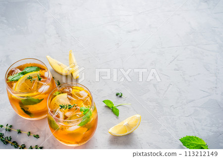 Iced tea with ice, mint and lemon. Iced tea with ice, mint and lemon. 113212149