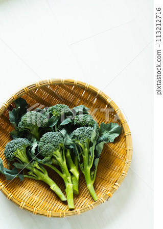 Broccoli sticks in a colander Broccoli sticks in a colander 113212716
