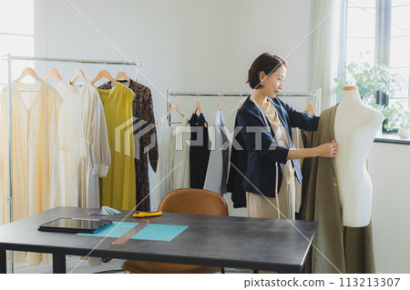 Women working in the apparel industry Women working in the apparel industry 113213307