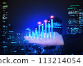 Chart business show up trend data on businessman 's hand with blur background night city , business finance concept. 113214054