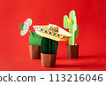 Cinco de Mayo concept - paper craft cactus in sombrero on solid color background 113216046