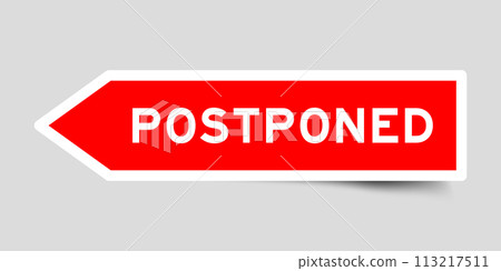 Red color arrow shape sticker label with word postponed on gray background 113217511