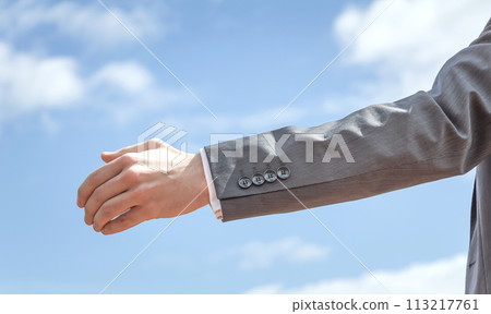 Closeup of business man showing his open hand Closeup of business man showing his open hand 113217761