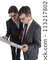 Couple of architects revising a house project on white background 113217802