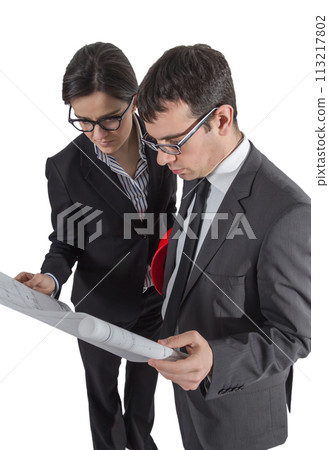 Couple of architects revising a house project on white background 113217802
