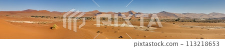 Panoramic picture of the red dunes of the Namib Desert in Namibia against a blue sky in the evening light Panoramic picture of the red dunes of the Namib Desert in Namibia against a blue sky in the evening light 113218653