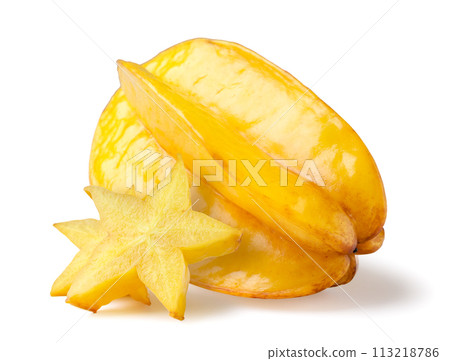 Carambola fruit and star pieces close-up on a white. Isolated Carambola fruit and star pieces close-up on a white. Isolated 113218786