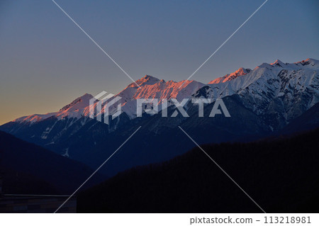 Dawn's First Light on Mountain Range 113218981