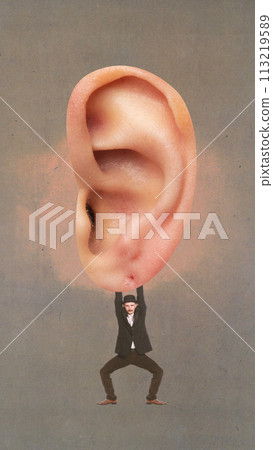 Poster. Contemporary art collage. Young man in retro outfit hanging from giant ear against brown background. Poster. Contemporary art collage. Young man in retro outfit hanging from giant ear against brown background. 113219589