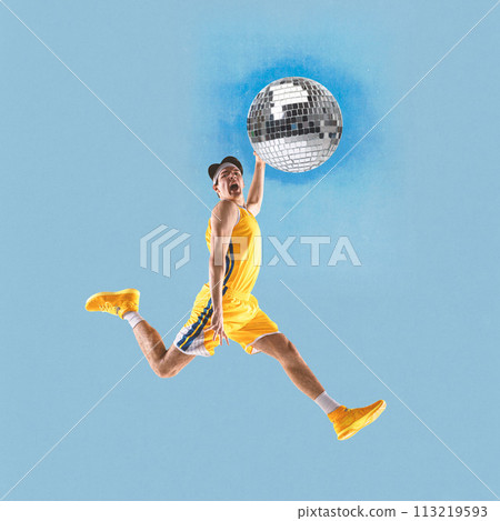 Poster. Contemporary art collage. Young athlete man, player playing disco ball as basketball ball against blue background. Poster. Contemporary art collage. Young athlete man, player playing disco ball as basketball ball against blue background. 113219593