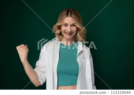 Woman in Green Top and White Jacket 113220040