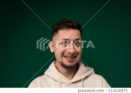 Smiling Man in White Hoodie Smiling Man in White Hoodie 113220671