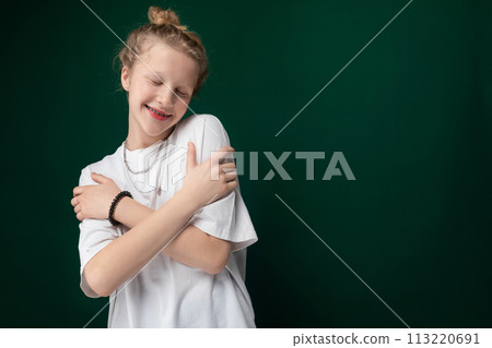 Young Girl Smiling and Hugging Arms 113220691