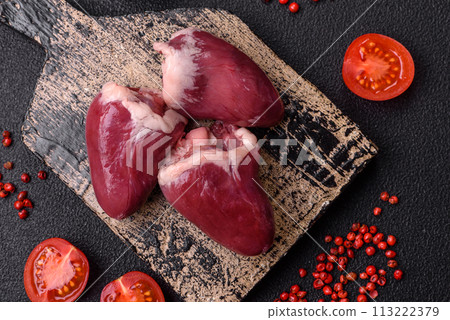 Raw turkey or chicken hearts with salt and spices Raw turkey or chicken hearts with salt and spices 113222379