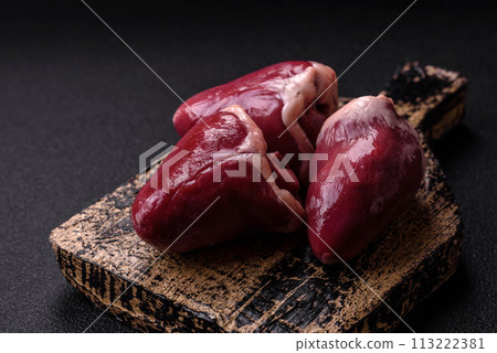 Raw turkey or chicken hearts with salt and spices Raw turkey or chicken hearts with salt and spices 113222381
