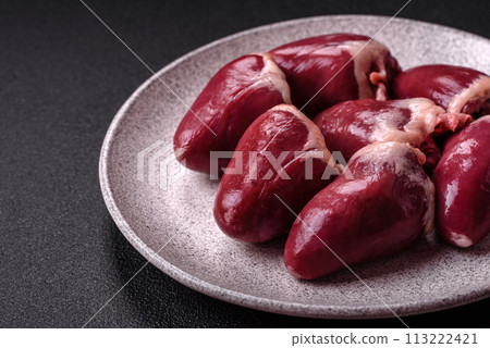 Raw turkey or chicken hearts with salt and spices Raw turkey or chicken hearts with salt and spices 113222421