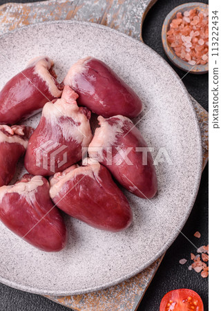 Raw turkey or chicken hearts with salt and spices Raw turkey or chicken hearts with salt and spices 113222434