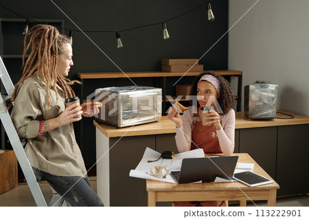 Girls having conversation at lunch break Girls having conversation at lunch break 113222901
