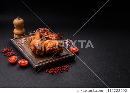 Delicious chicken legs baked on the grill with salt, spices and herbs 113222990