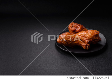 Delicious chicken legs baked on the grill with salt, spices and herbs Delicious chicken legs baked on the grill with salt, spices and herbs 113223031