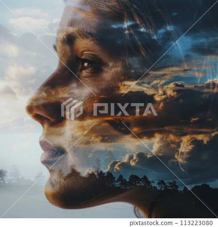 Artistic double exposure of a woman's profile with a dramatic cloudscape 113223080