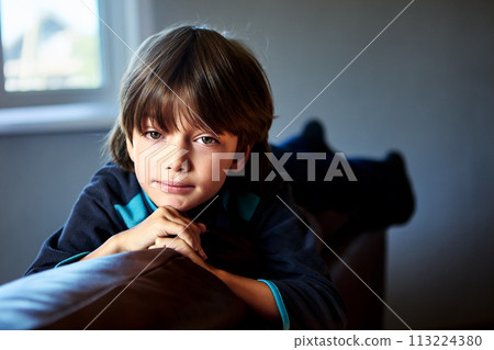 Bored little boy 7 years old alone in room. Bored little boy 7 years old alone in room. 113224380