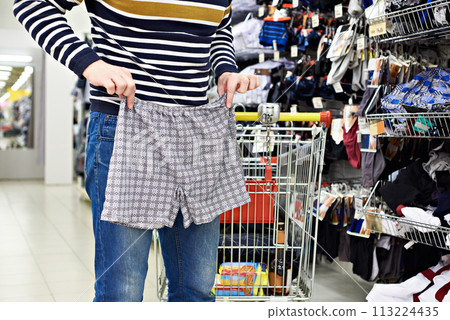 Man chooses panties in store 113224435