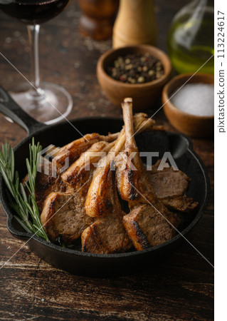 grilled lamb chop on cast iron pan 113224617