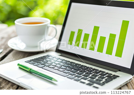 A laptop on a wooden table 113224767