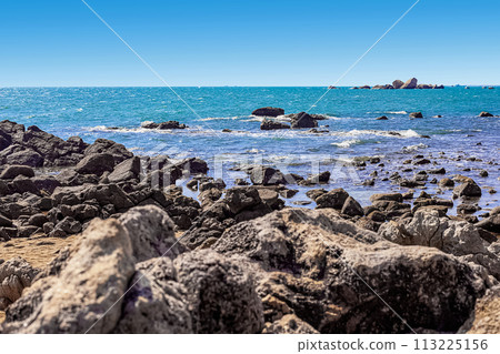 View of the rocky shore of the South China Sea in the World's End Park. Sanya, China View of the rocky shore of the South China Sea in the World's End Park. Sanya, China 113225156