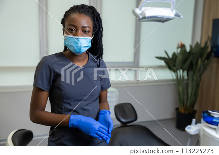 African american female dentist standing African american female dentist standing 113225273