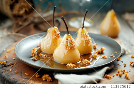Paleo style dessert poached pear dessert pashot. Pear caramelized in syrup on a wooden plate 113225612