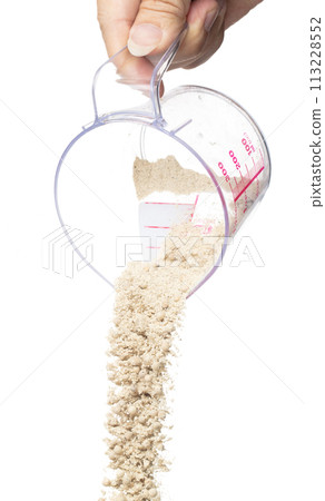 White Pepper seeds fall down pour in measured cup, white Pepper mix powder float explode, abstract cloud fly. Peppercorn mix powder splash throwing in Air. White background Isolated high speed shutter White Pepper seeds fall down pour in measured cup, white Pepper mix powder float explode, abstract cloud fly. Peppercorn mix powder splash throwing in Air. White background Isolated high speed shutter 113228552