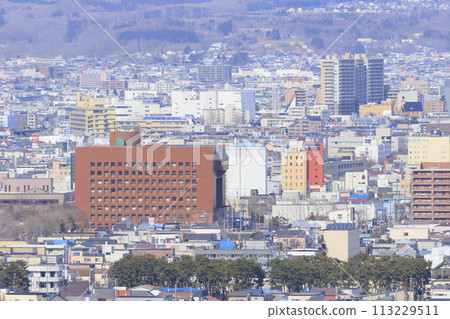 [Logo blurred] Hakodate City Hall and the surrounding downtown area 113229511