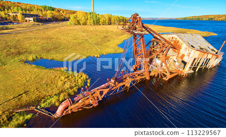 Aerial View of Abandoned Quincy Dredge Amidst Autumn Foliage 113229567