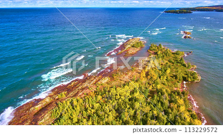 Aerial View of Secluded Forest Peninsula and Lake Superior Coast 113229572