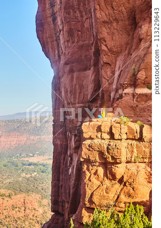 Sedona Sunset with Reflective Person on Cathedral Rock Cliffs Sedona Sunset with Reflective Person on Cathedral Rock Cliffs 113229643