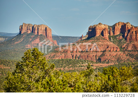Sedona Red Rock Cliffs and Green Vegetation Under Blue Sky Sedona Red Rock Cliffs and Green Vegetation Under Blue Sky 113229728